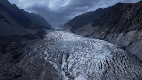A long shot of a glacier in the village of Passu